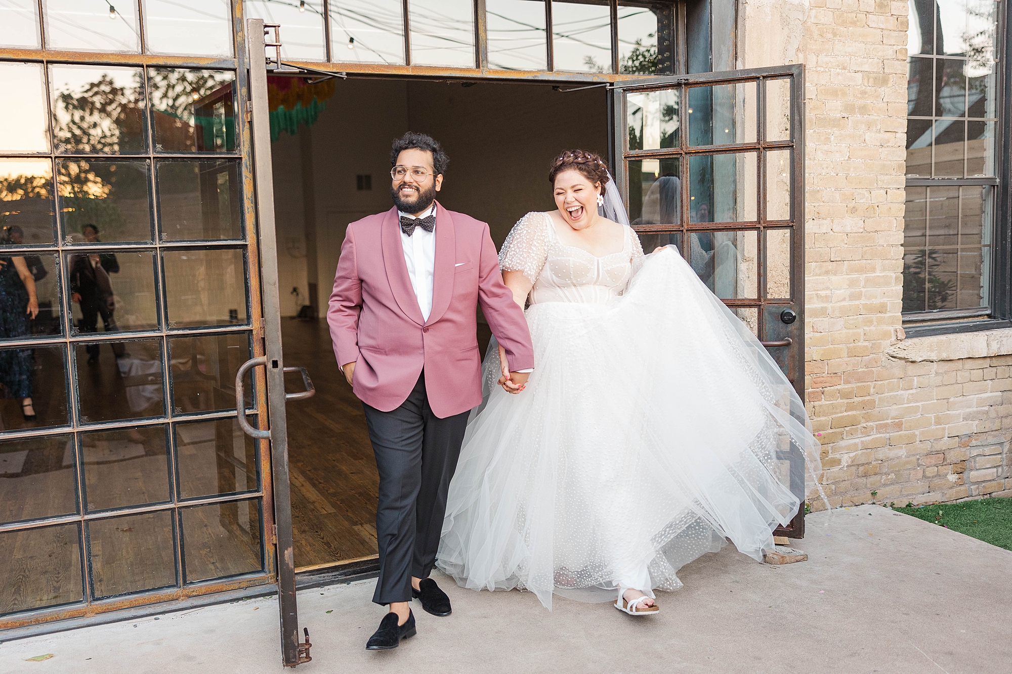 Joyful portrait of bride and groom mid-celebration at their fall wedding weekend in Texas