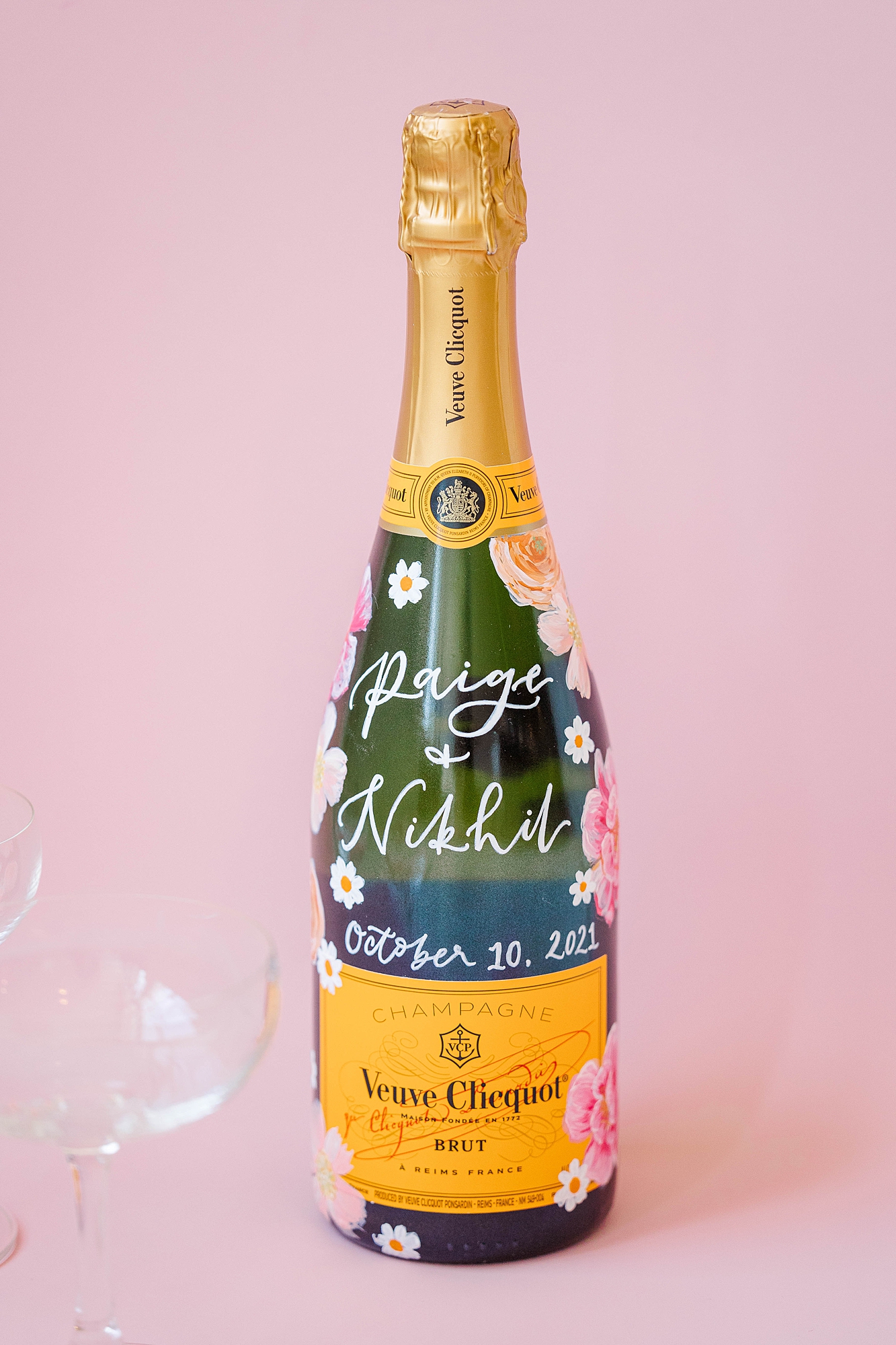 Detail photo of colorful stationery, bold florals and textured linens from the multi-day celebration