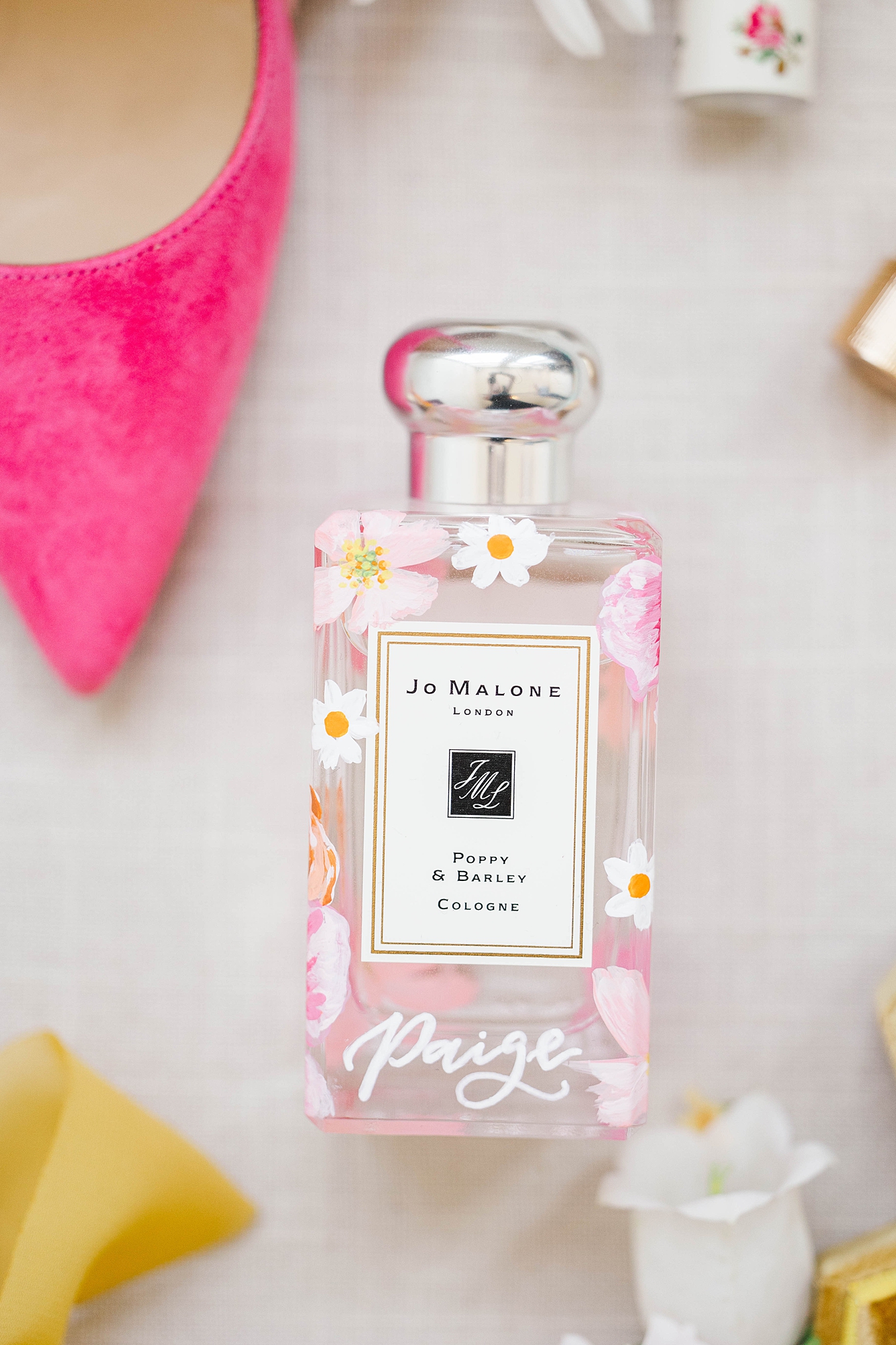 Detail photo of colorful stationery, bold florals and textured linens from the multi-day celebration