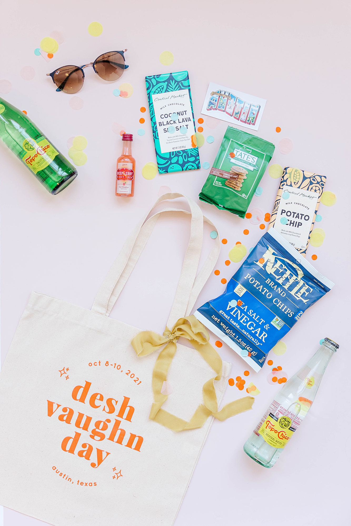 Detail photo of colorful stationery, bold florals and textured linens from the multi-day celebration