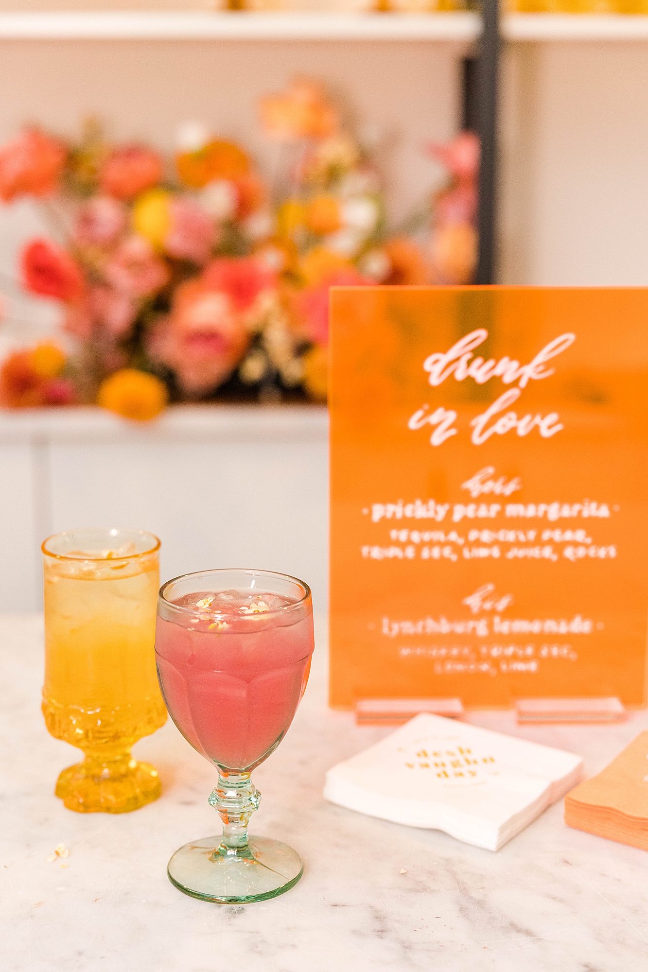 Western reception with retro-inspired decor in peach, mustard, teal and orange, guests dancing under fall light