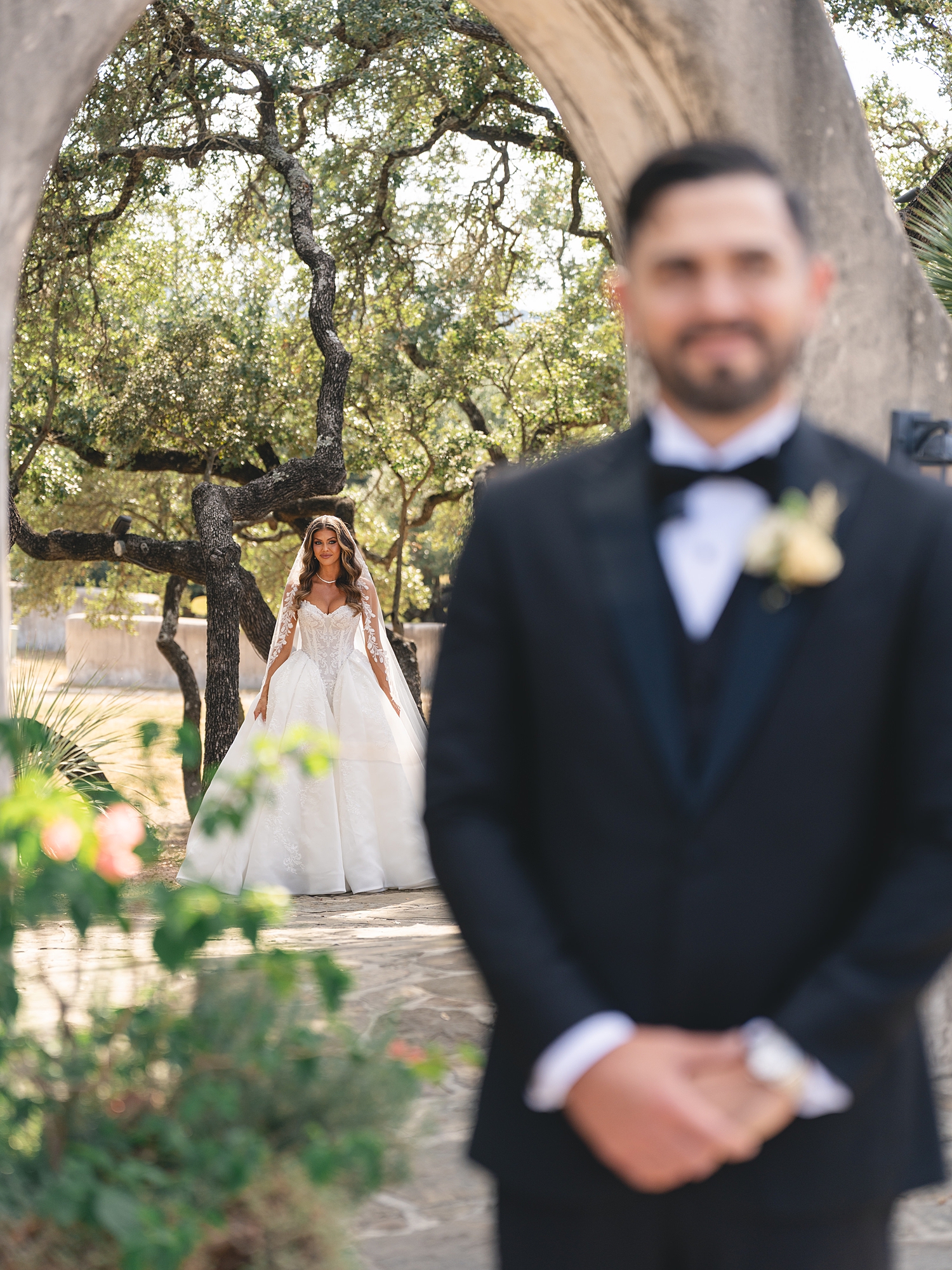 Bride and groom portrait under Spanish-mission style architecture in San Antonio