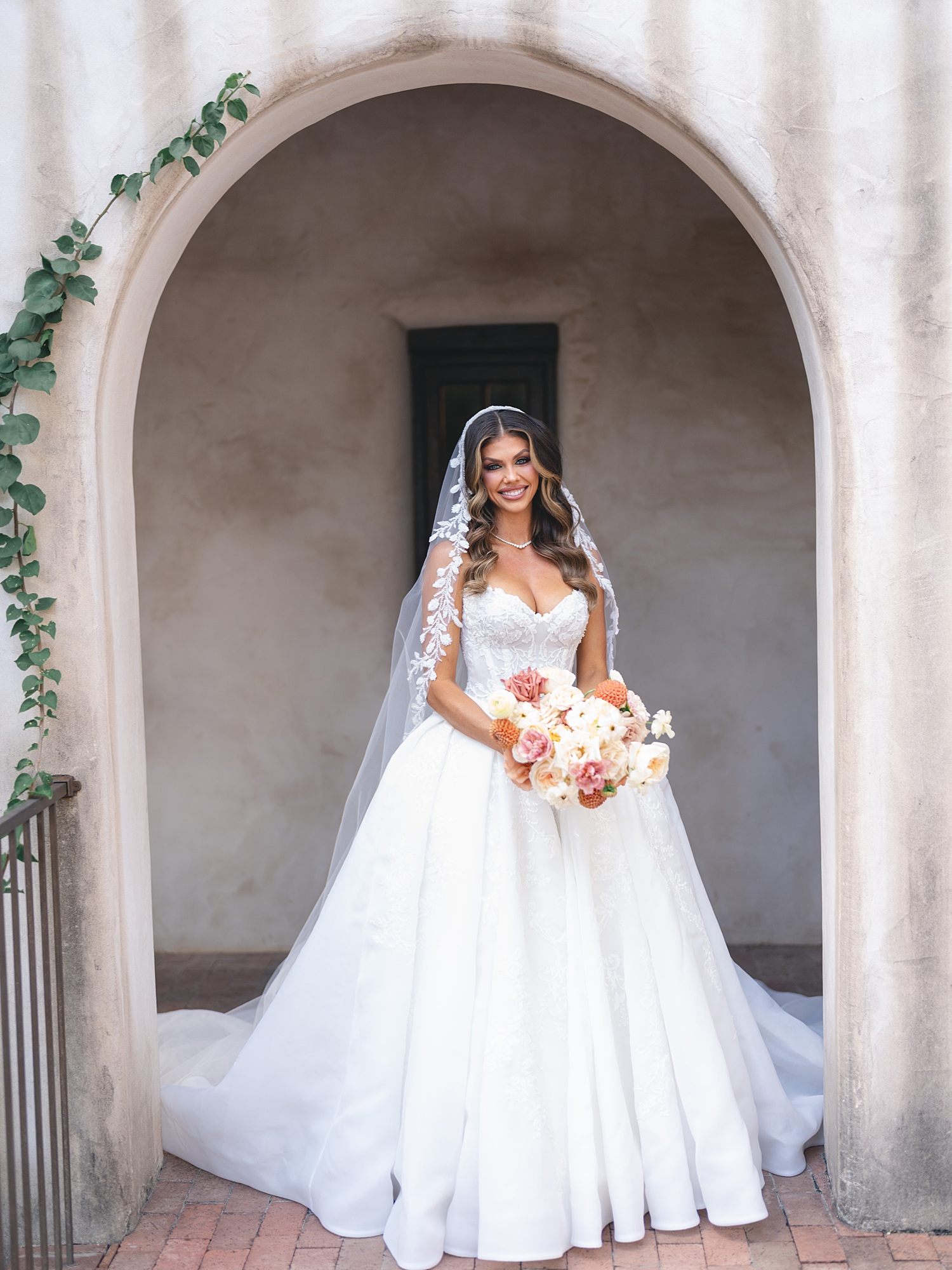 Bridal portrait under Spanish-mission style architecture in San Antonio