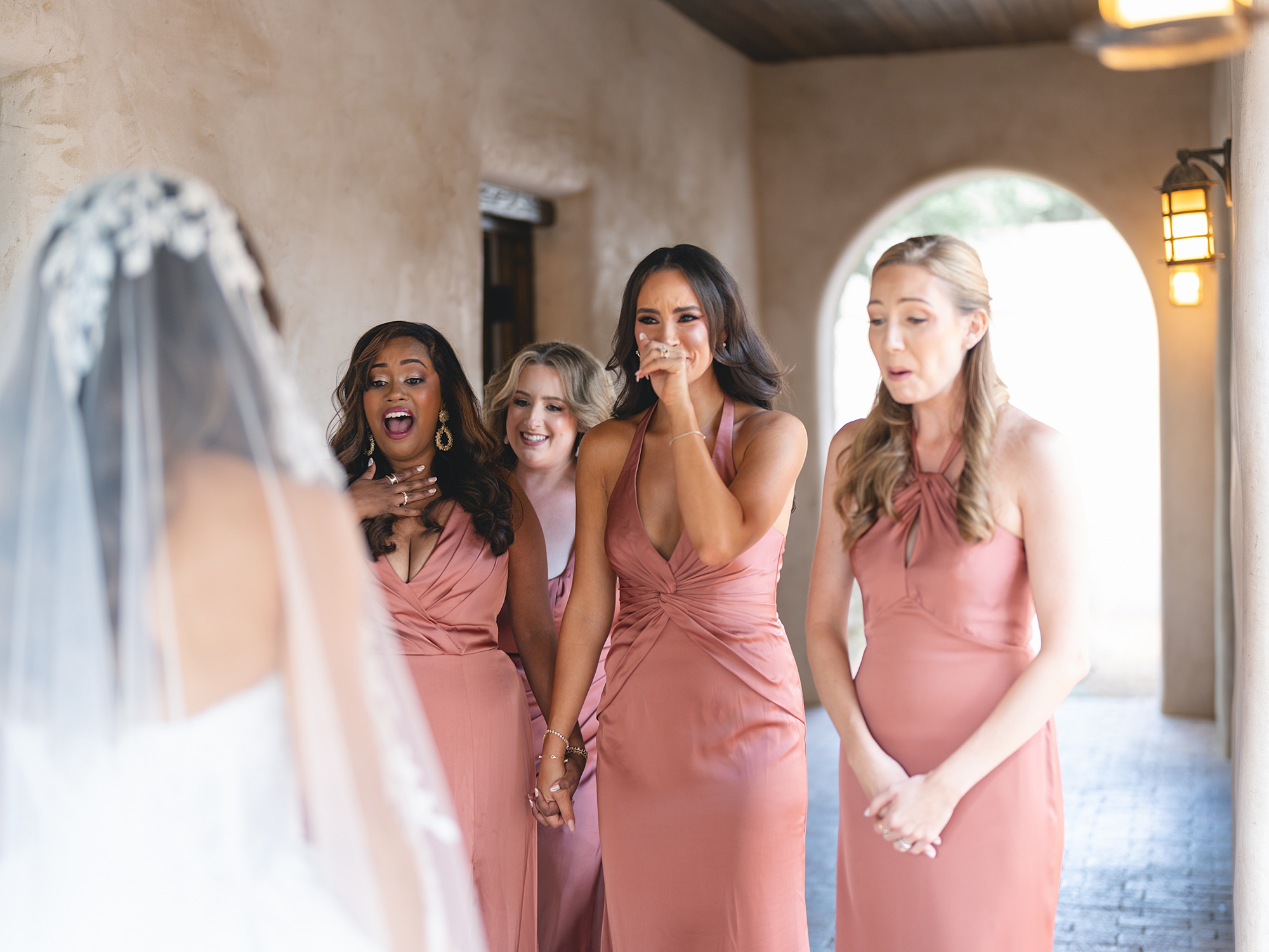 Bride getting ready in bridal suite with soft natural light at San Antonio wedding