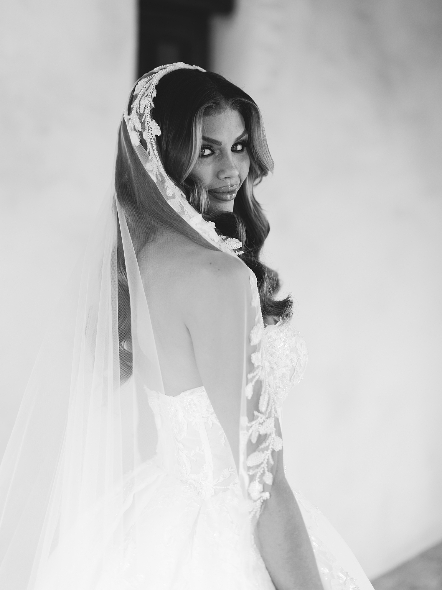 Bride getting ready in bridal suite with soft natural light at San Antonio wedding