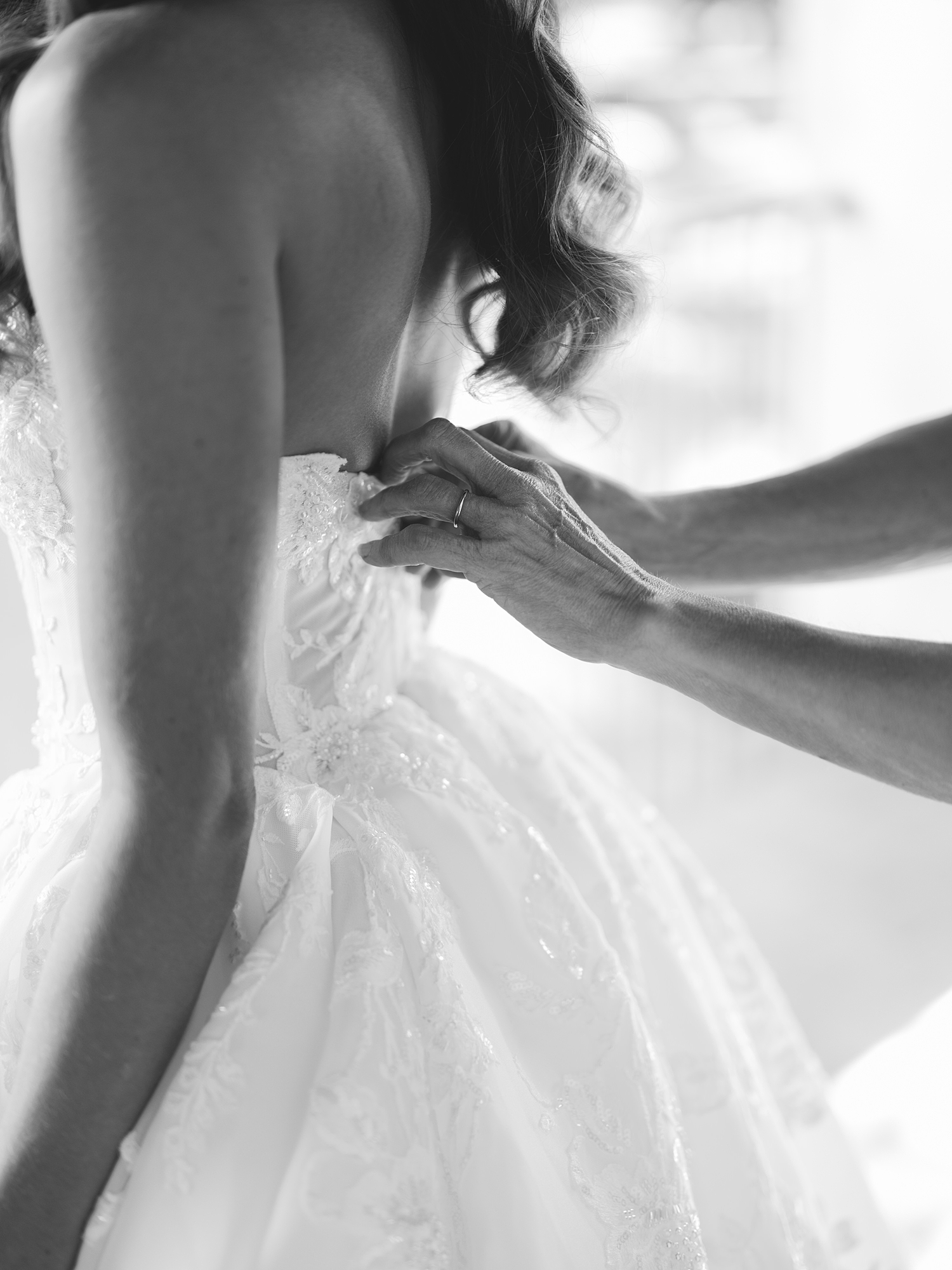 Bride getting ready in bridal suite with soft natural light at San Antonio wedding