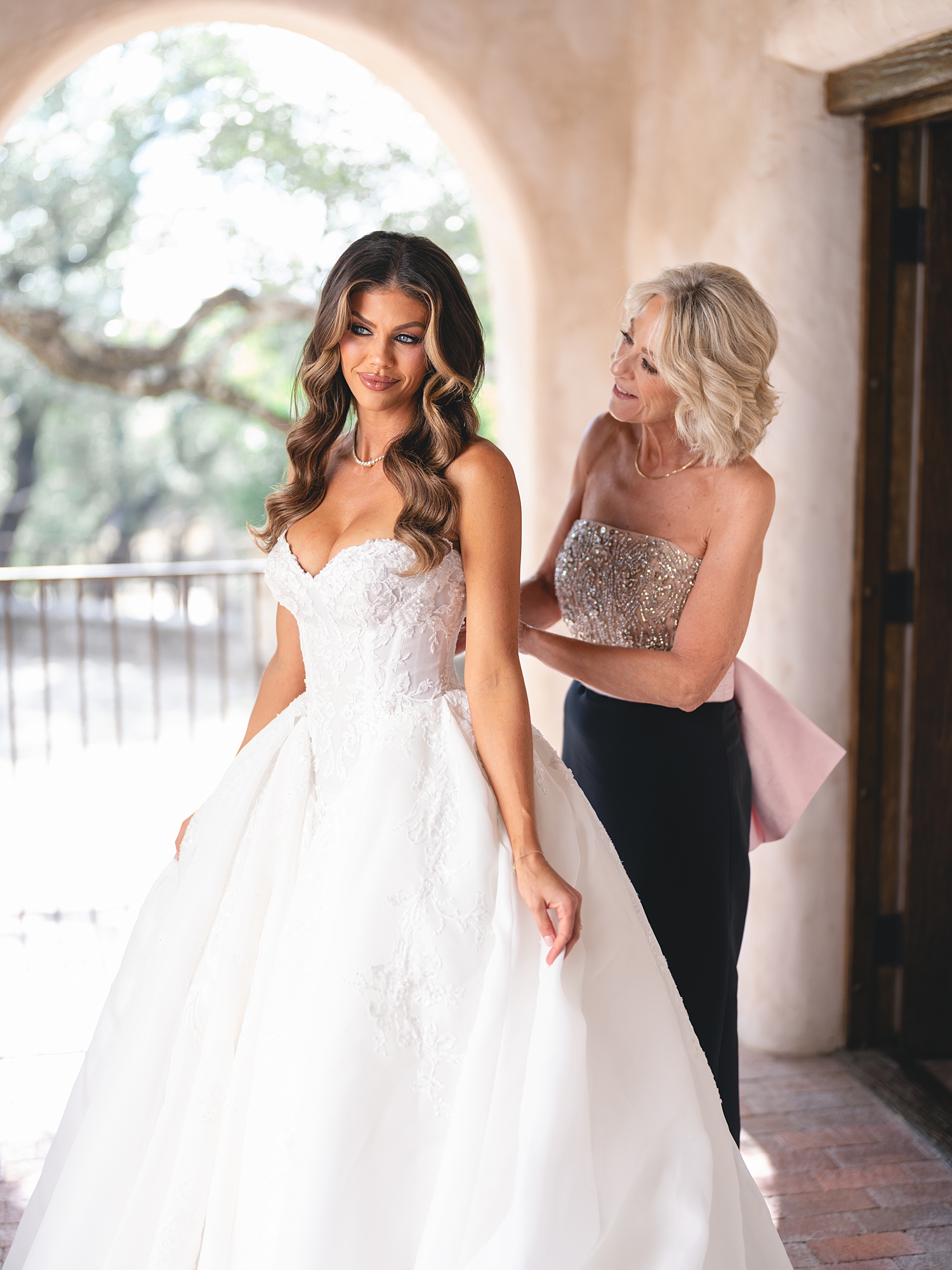 Bride getting ready in bridal suite with soft natural light at San Antonio wedding
