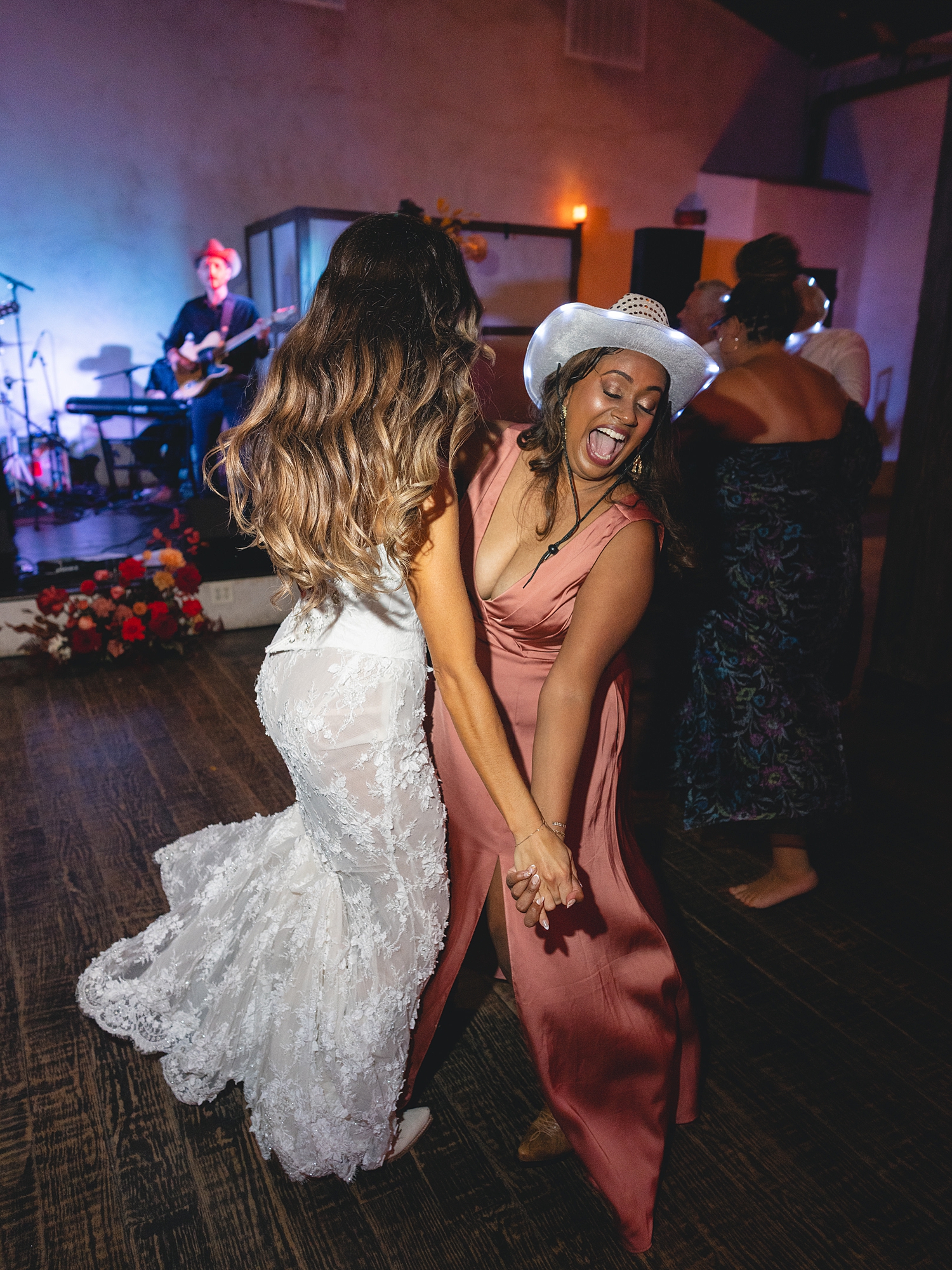 wedding guests dancing and celebrating on the reception dance floor at San Antonio wedding celebration