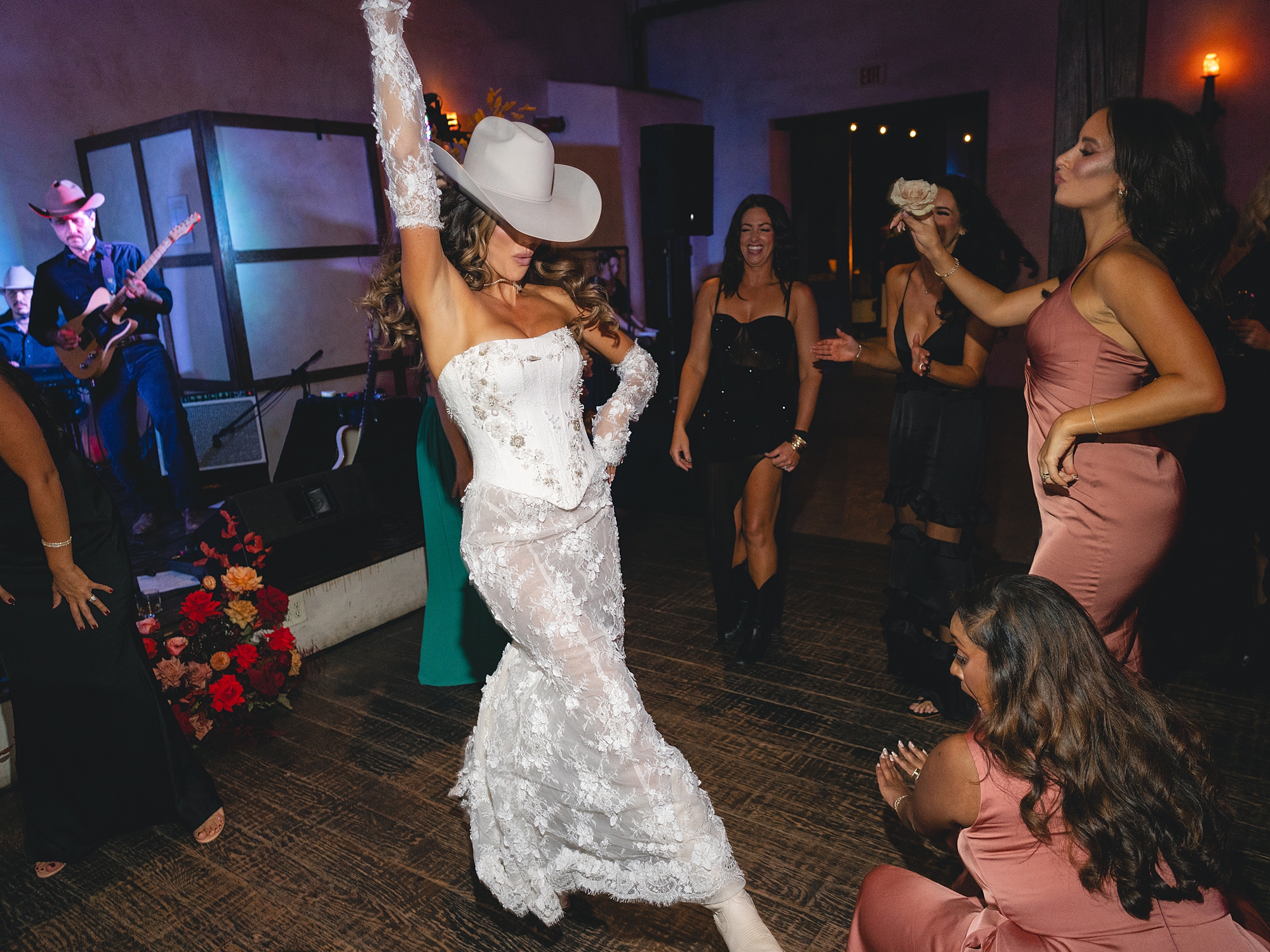 wedding guests dancing and celebrating on the reception dance floor at San Antonio wedding celebration