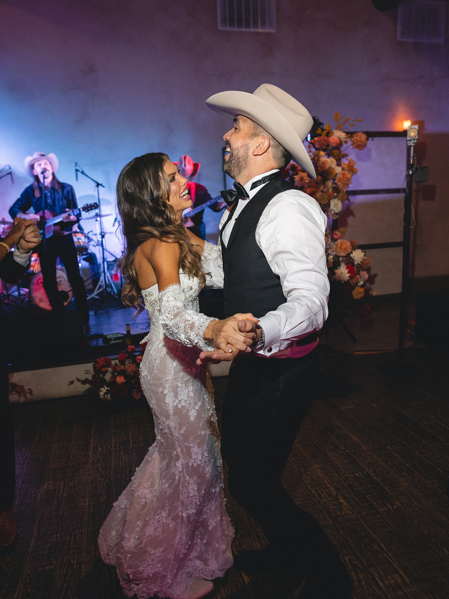 wedding guests dancing and celebrating on the reception dance floor at San Antonio wedding celebration