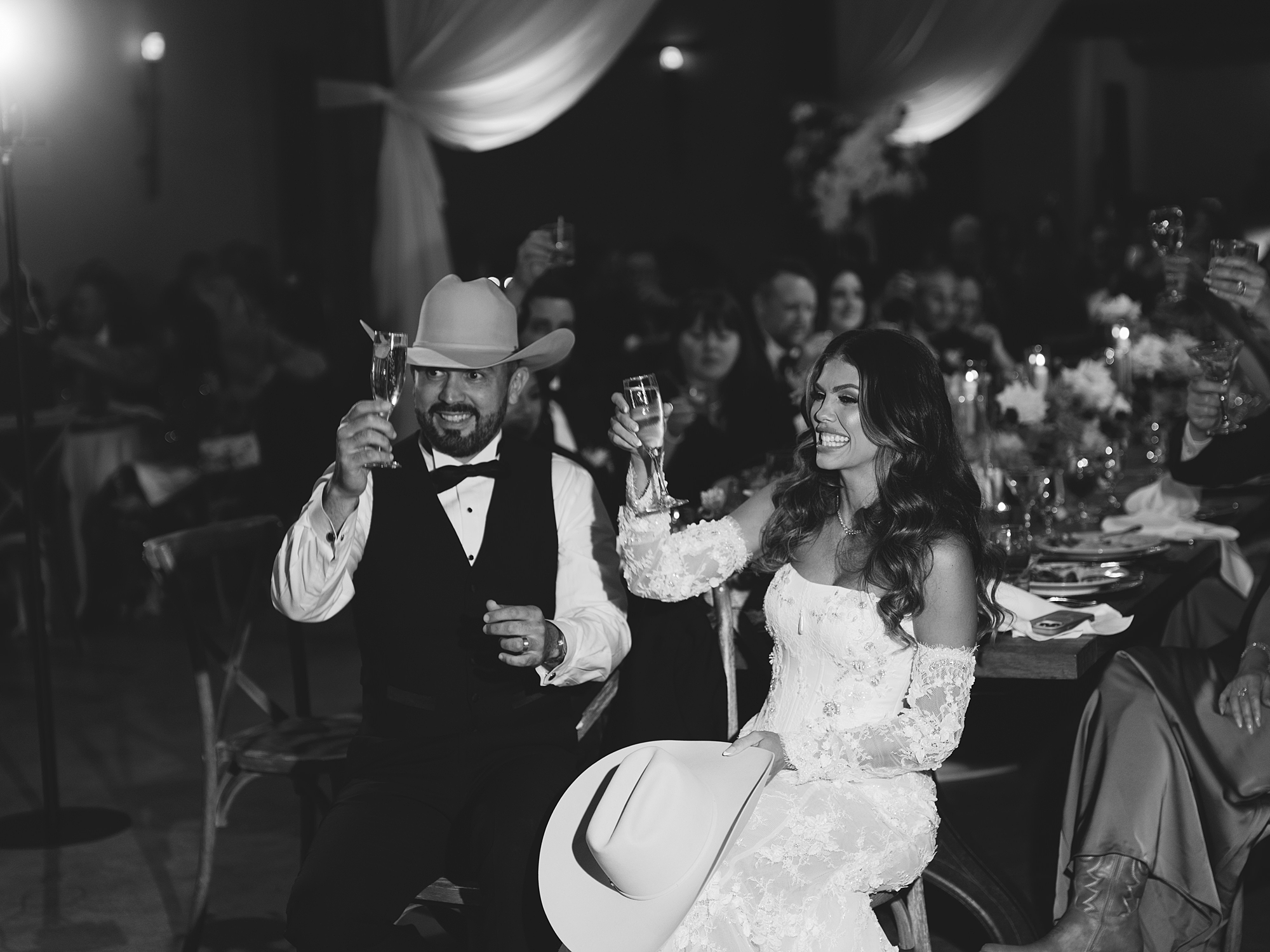 toasts and guests celebrating in the warm evening light at San Antonio reception by Paige Vaughn Photo