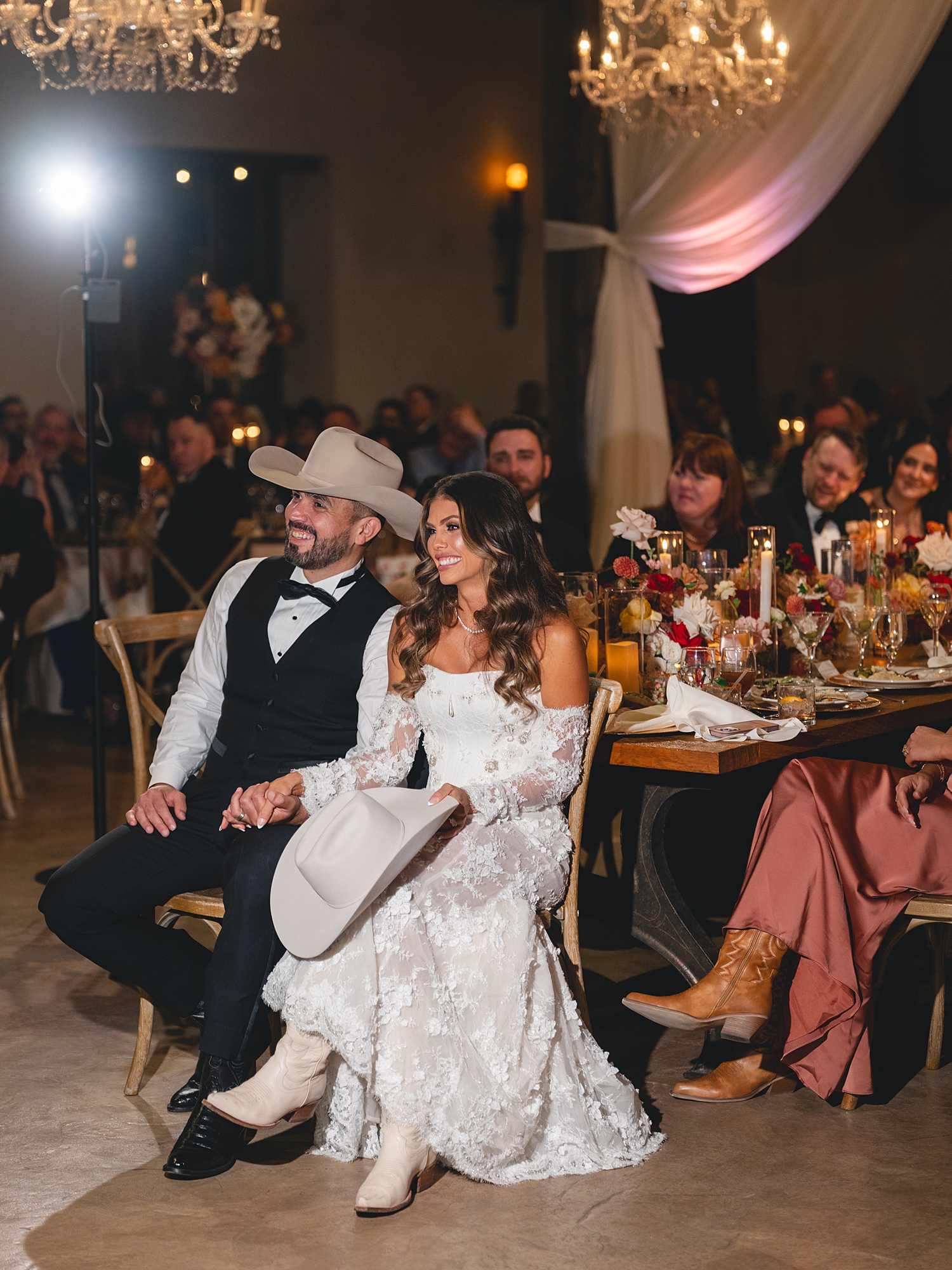 toasts and guests celebrating in the warm evening light at San Antonio reception by Paige Vaughn Photo