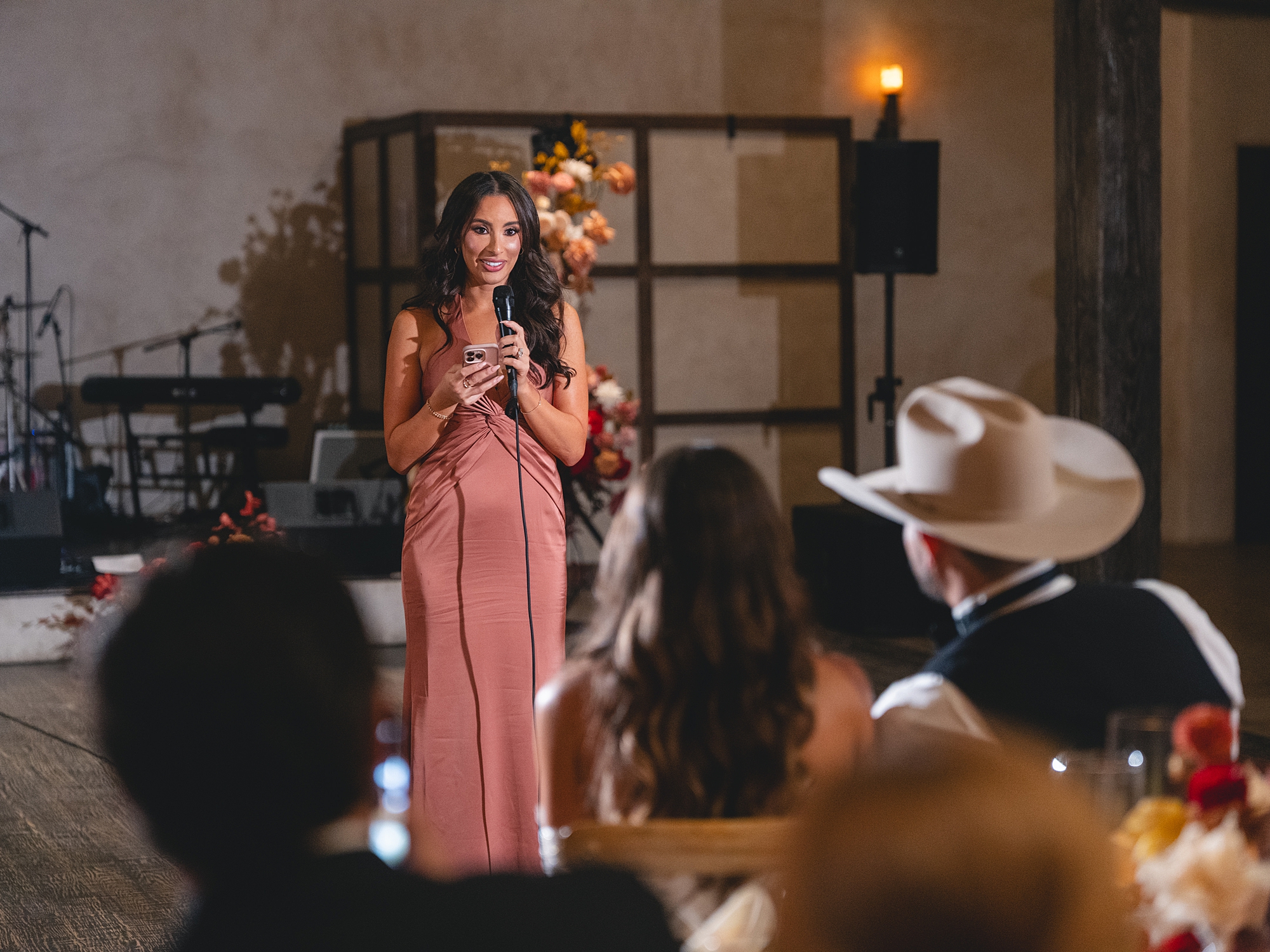 toasts and guests celebrating in the warm evening light at San Antonio reception by Paige Vaughn Photo