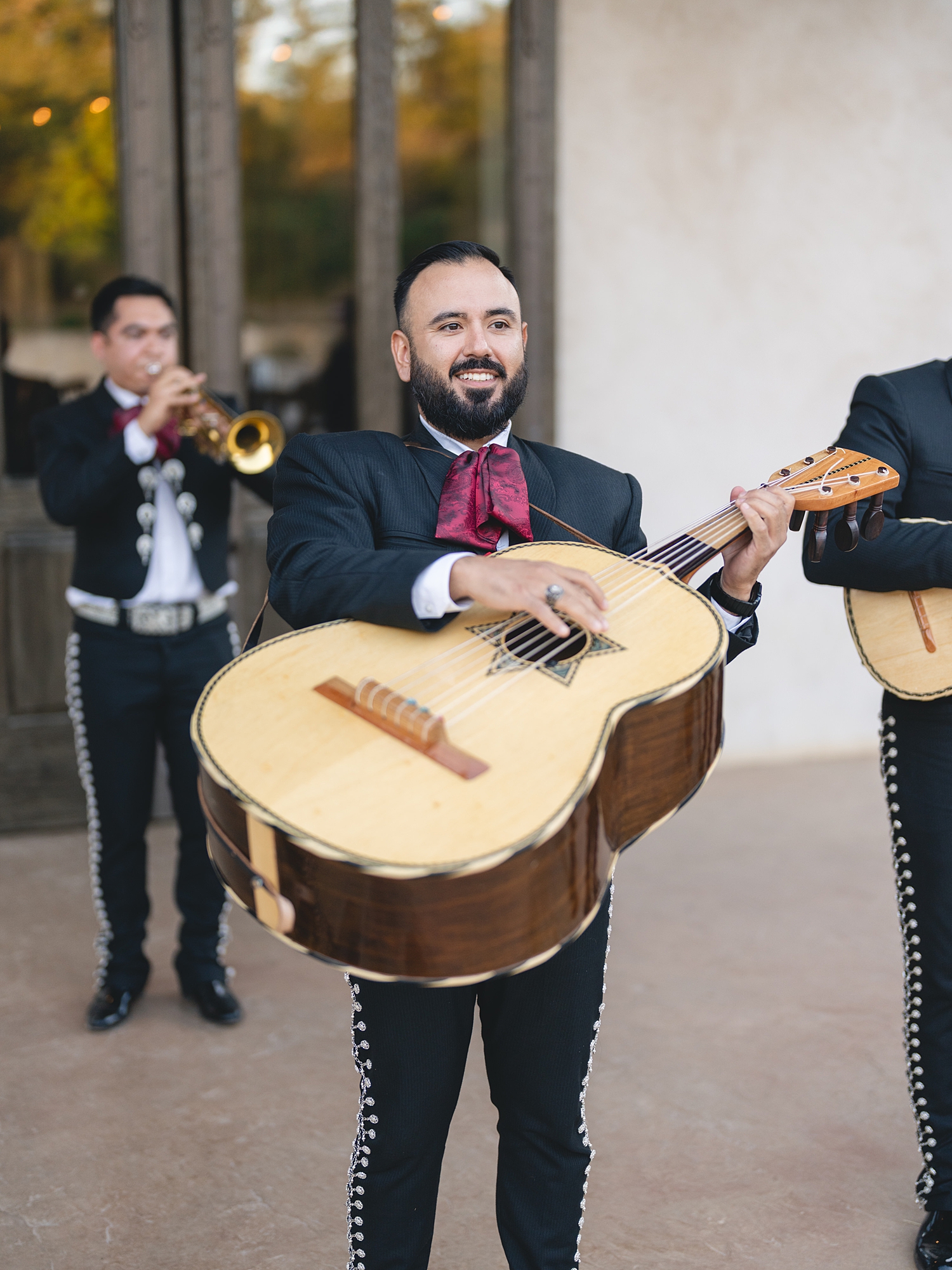 Reception tablescape with lush florals, elegant linens, and candlelight at San Antonio wedding with mariachi band