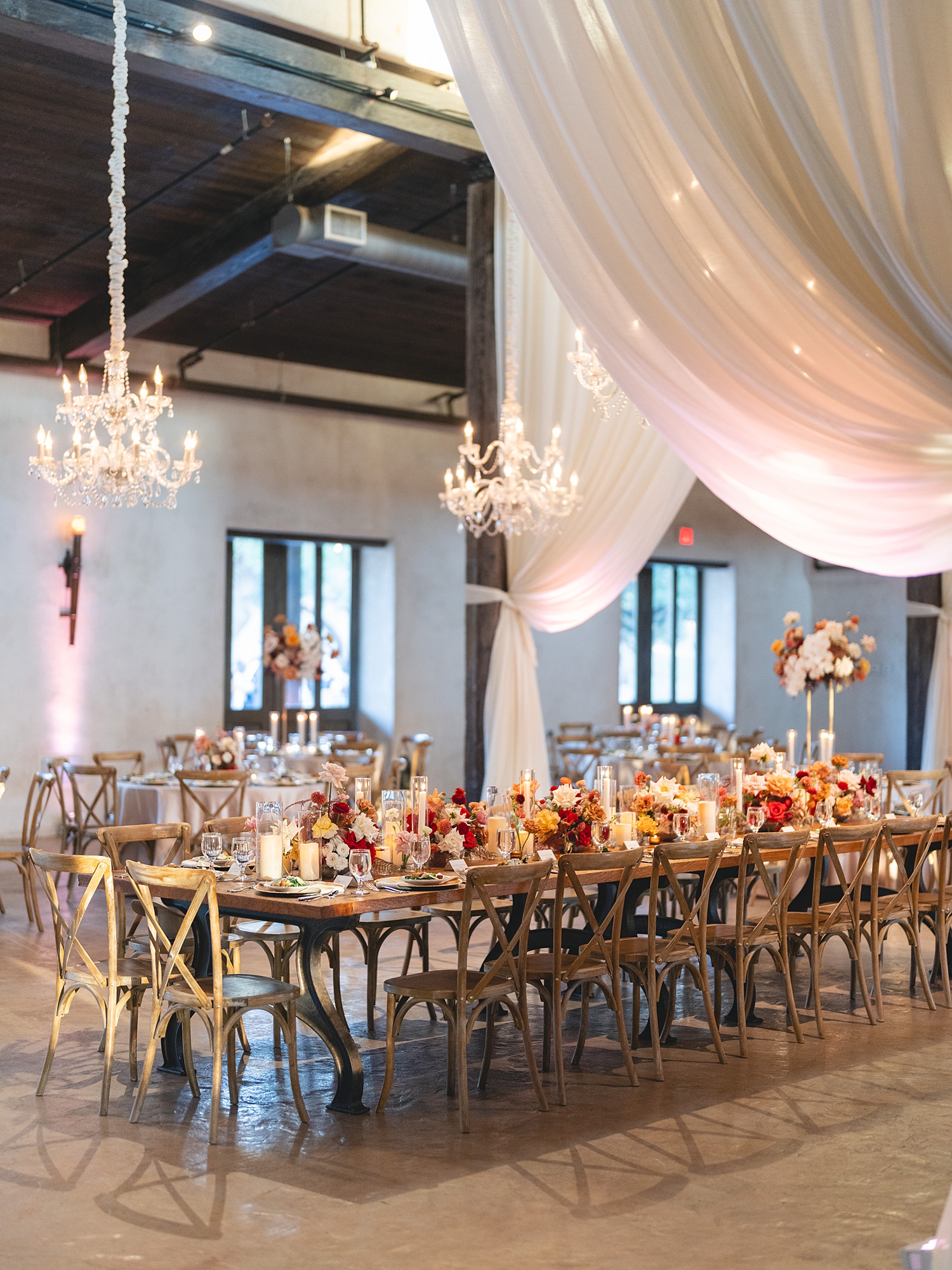 Reception tablescape with lush florals, elegant linens, and candlelight at San Antonio wedding