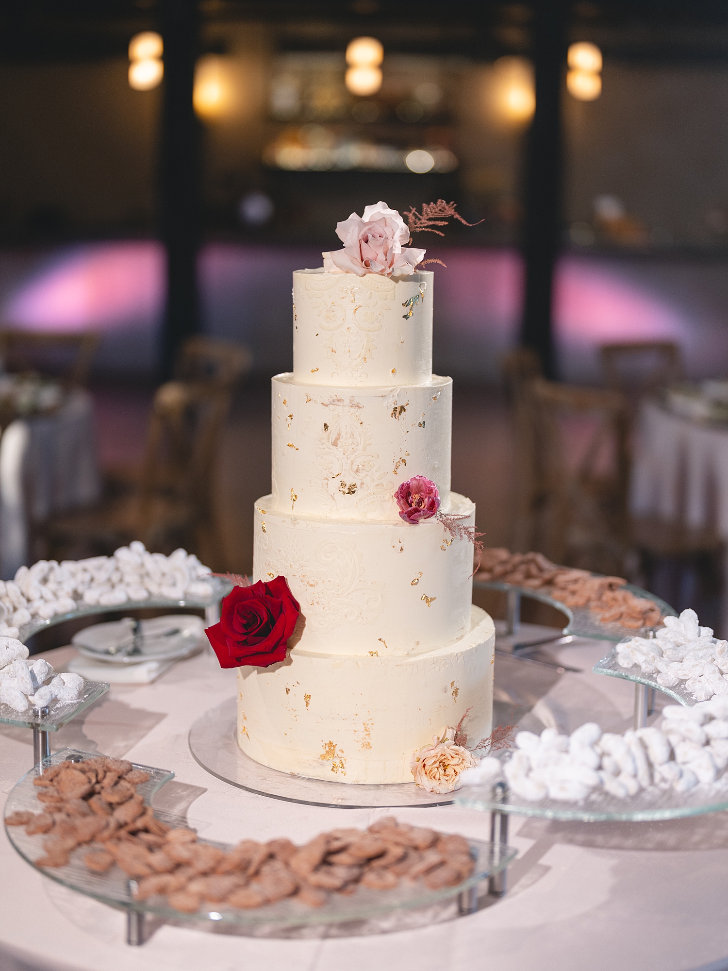 Reception tablescape with lush florals, elegant linens, and candlelight at San Antonio wedding