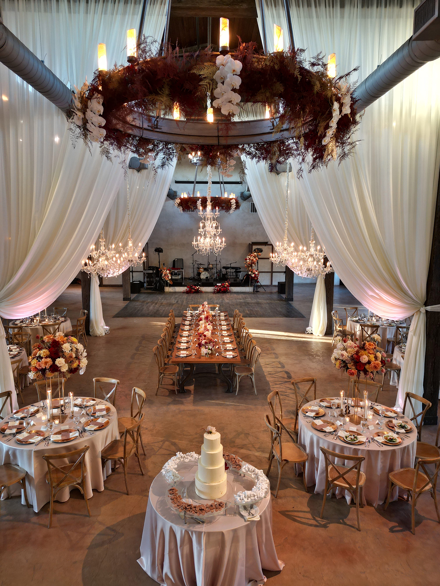 Reception tablescape with lush florals, elegant linens, and candlelight at San Antonio wedding
