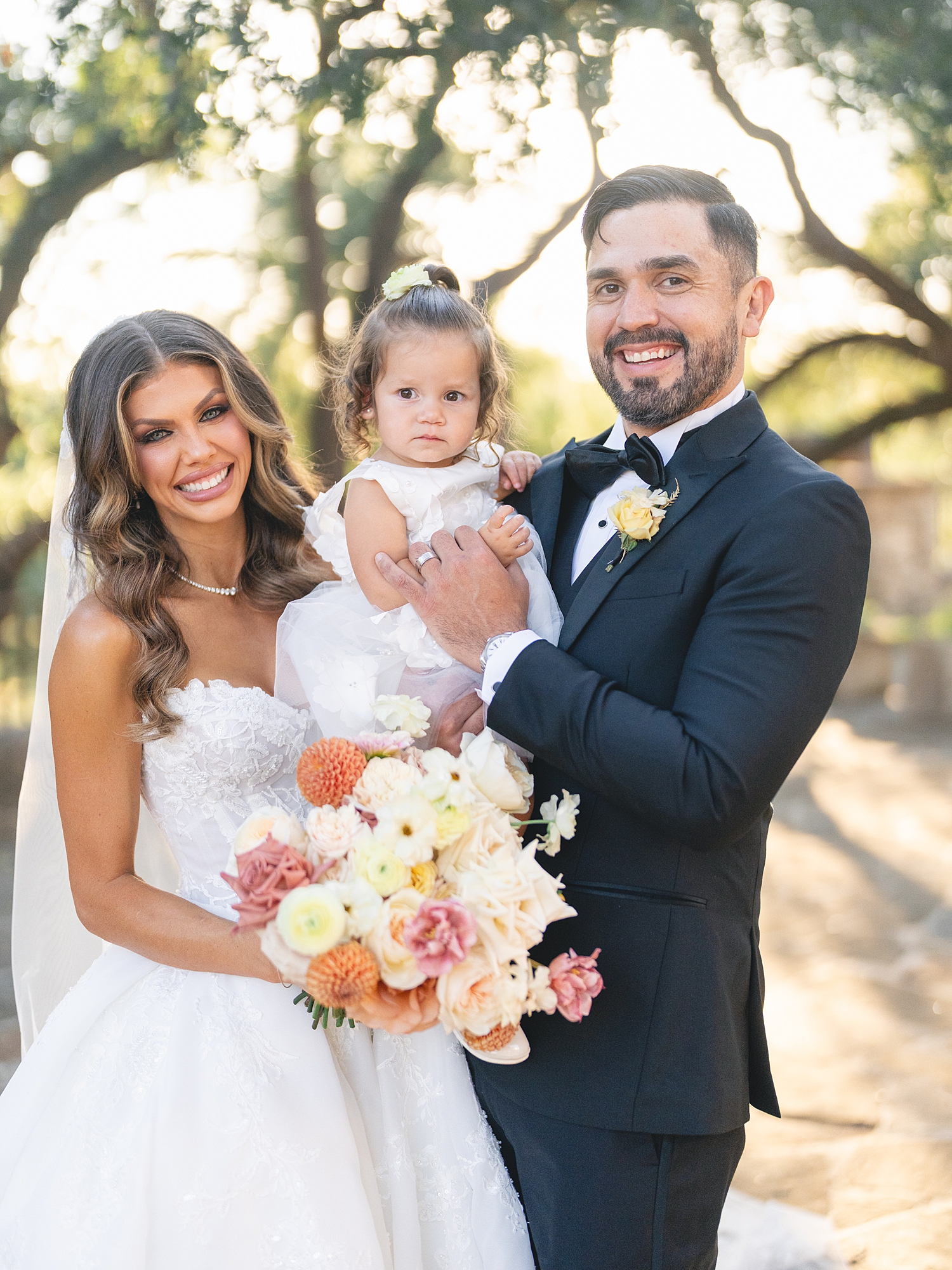 Bride and groom portrait under Spanish-mission style architecture in San Antonio