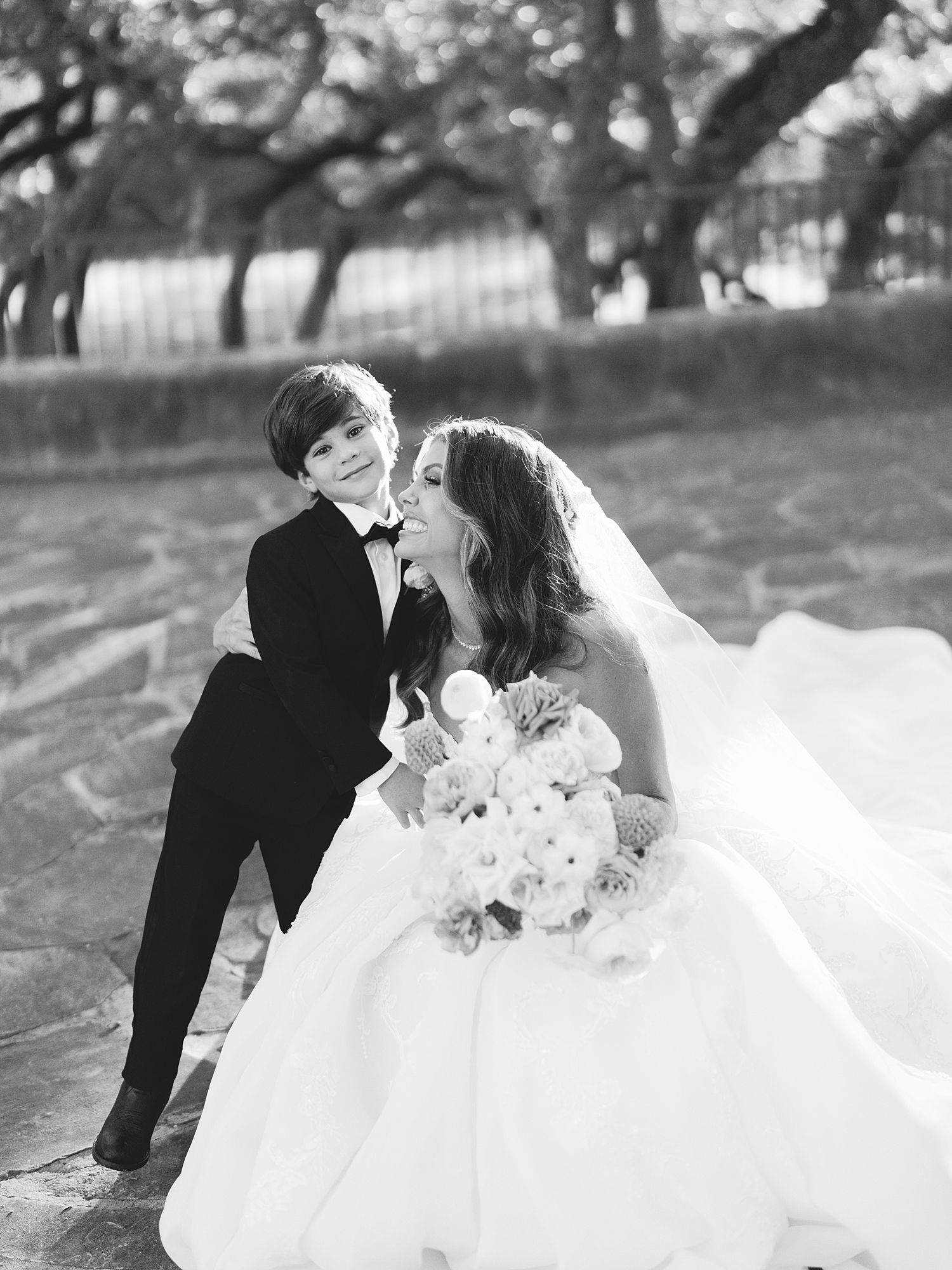 Bride and groom portrait under Spanish-mission style architecture in San Antonio