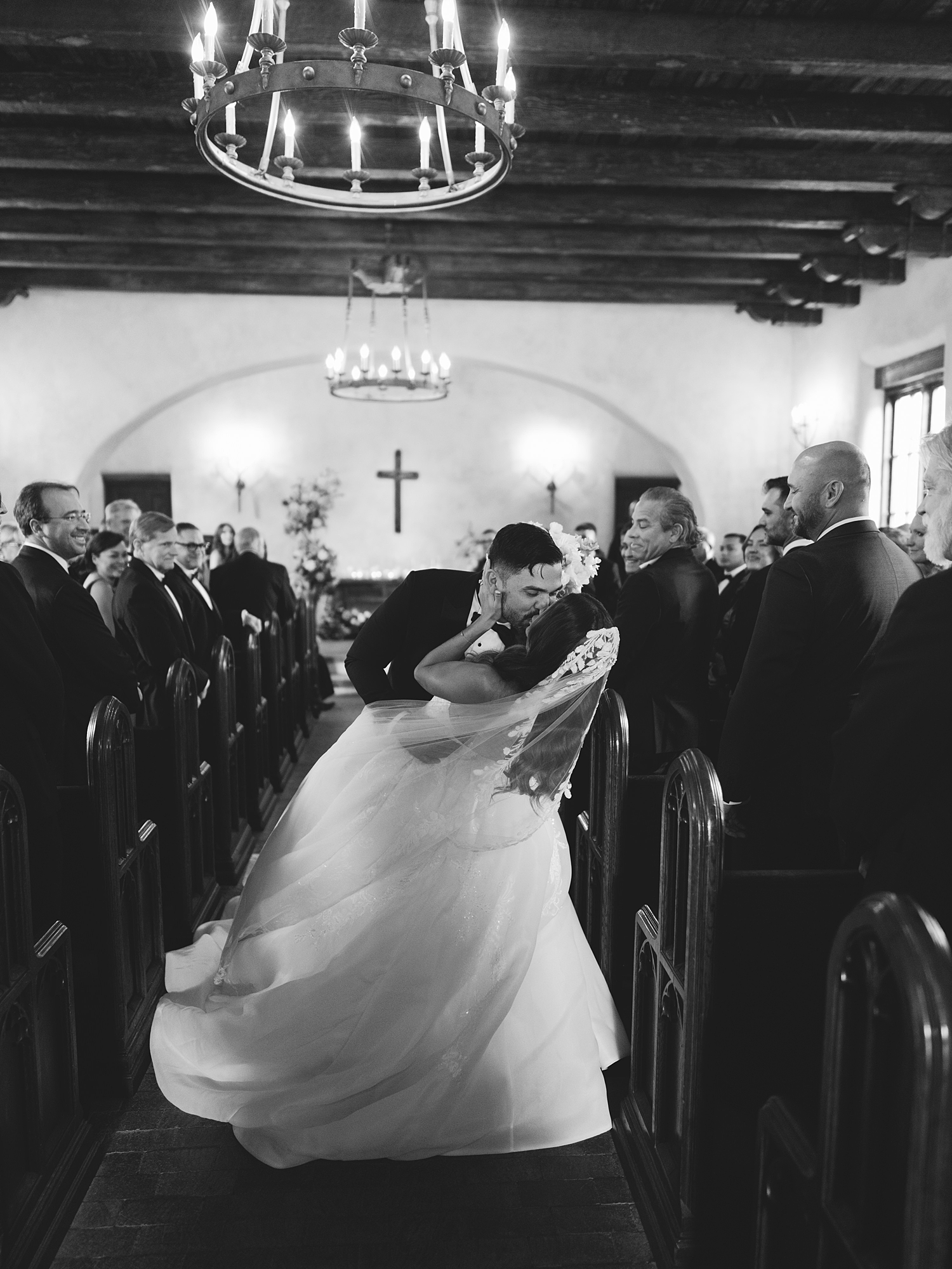 ceremony at San Antonio venue with guests seated, rustic ceremony backdrop