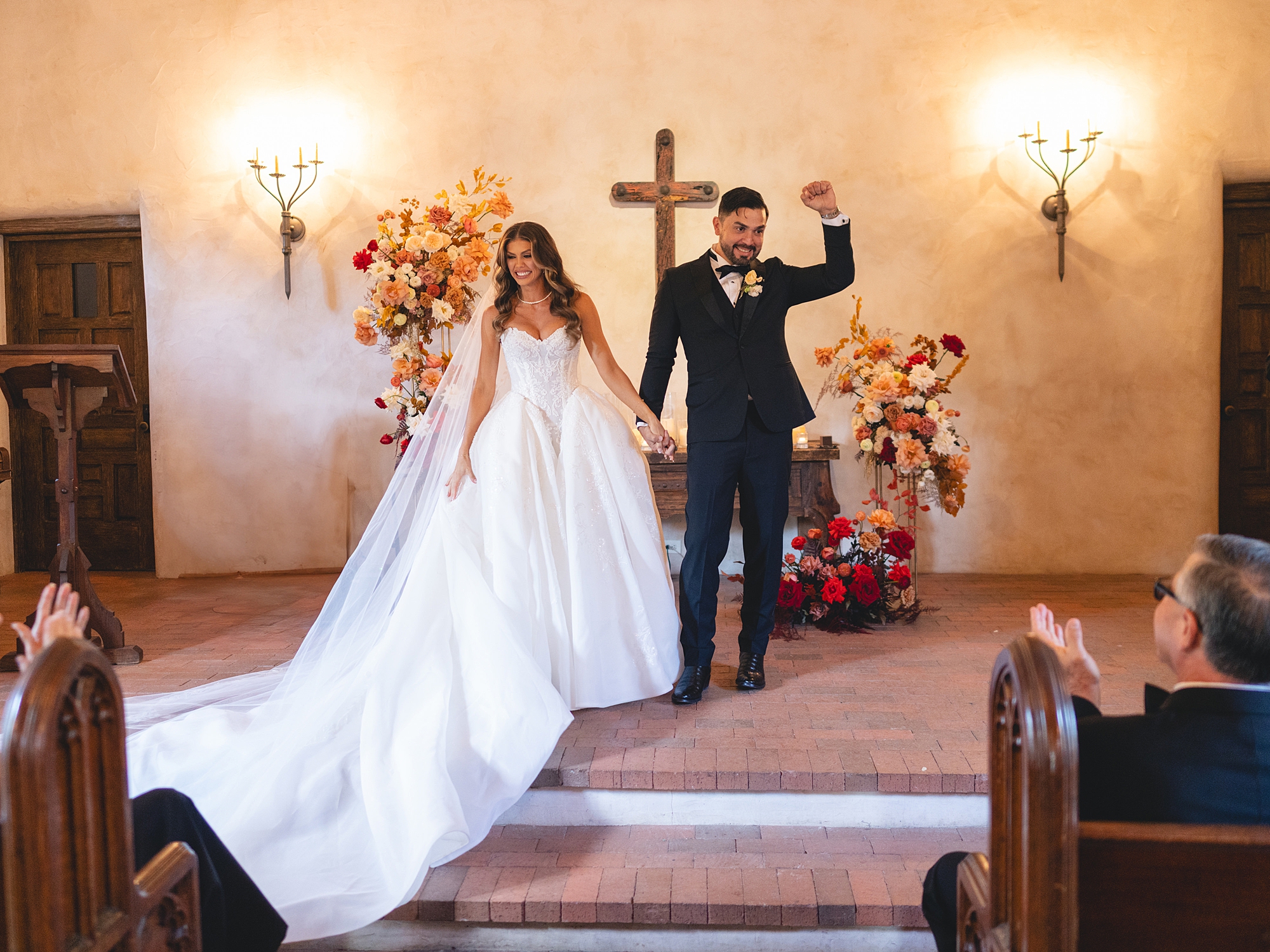 ceremony at San Antonio venue with guests seated, rustic ceremony backdrop