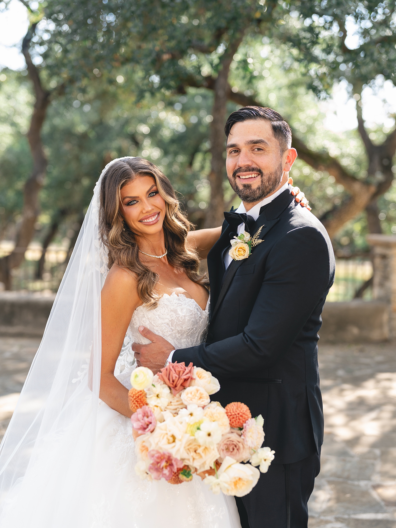 romantic bride and groom portrait under trees