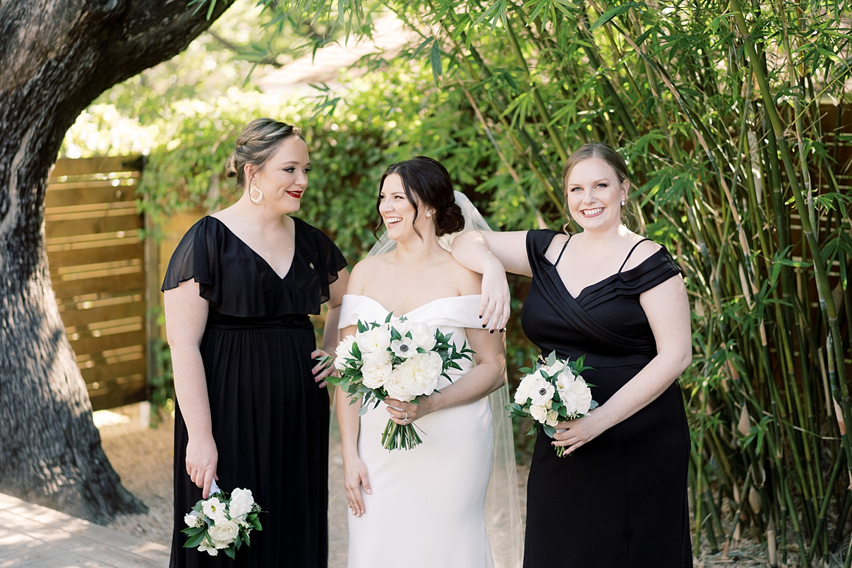 Bride smiles with two bridesmaids during an intimate elopement for wedding photographer Paige Vaughn Photography