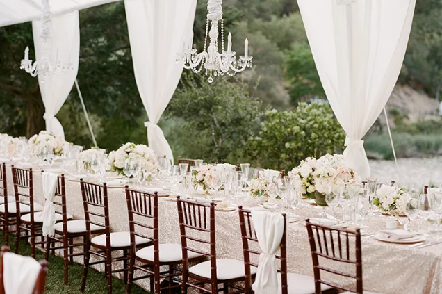 A clean, elegant, outdoor wedding reception table set up at Calistoga Ranch, one of the best outdoor wedding venues in the California Bay Area