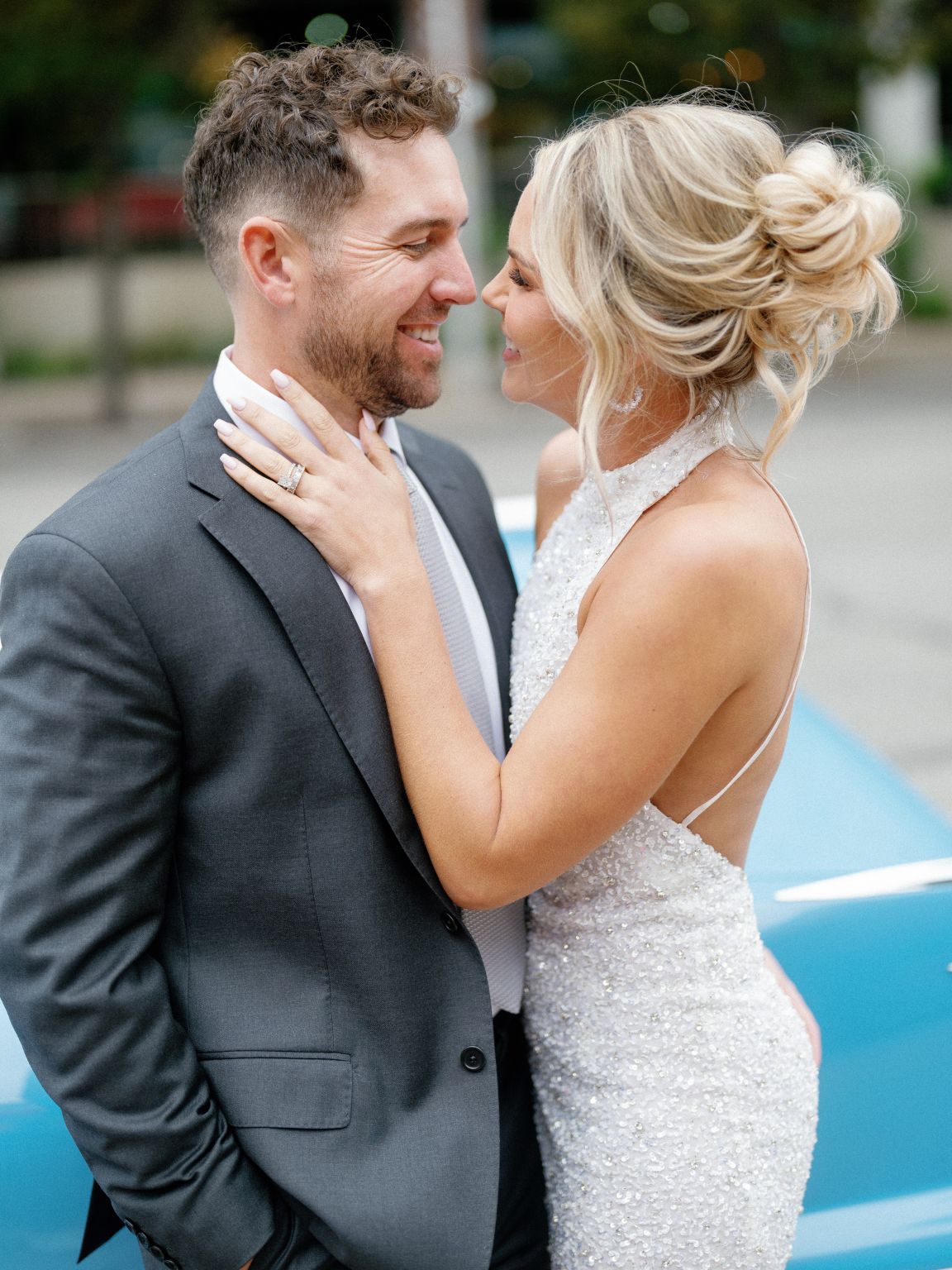 bride and groom chic and moody austin engagement photos in front of vintage care