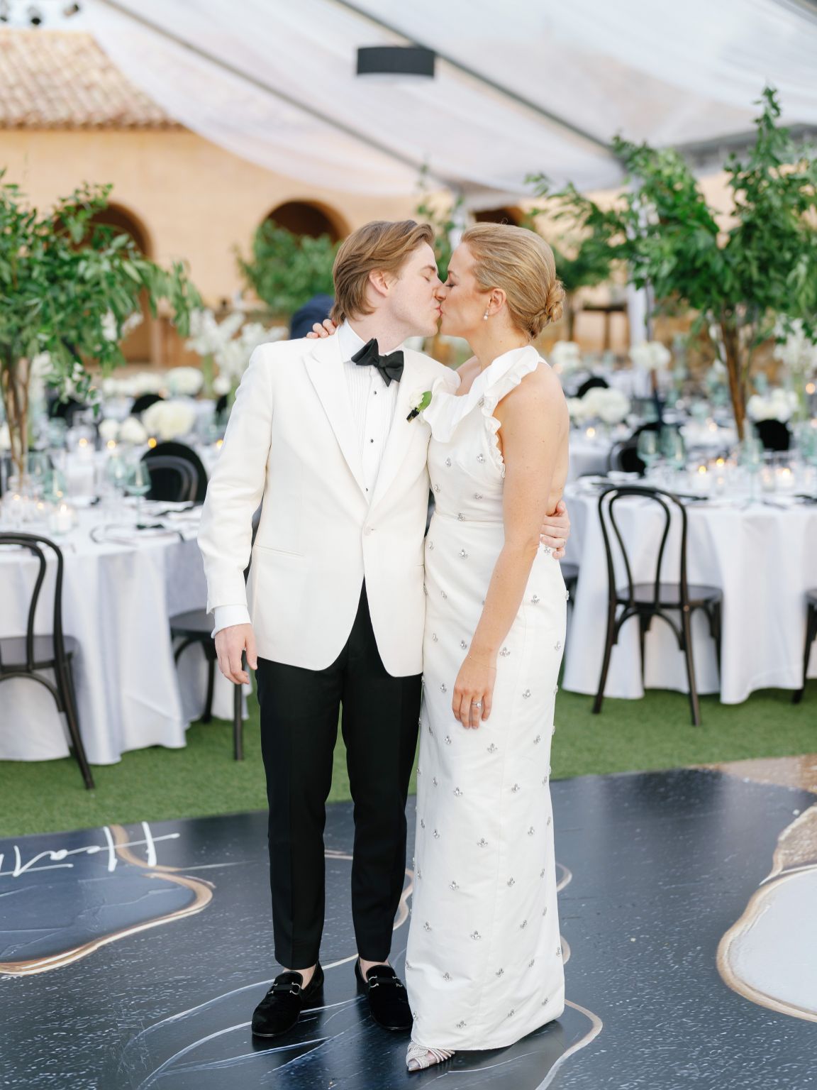 Escondido horseshoe bay wedding bride and groom kiss in reception