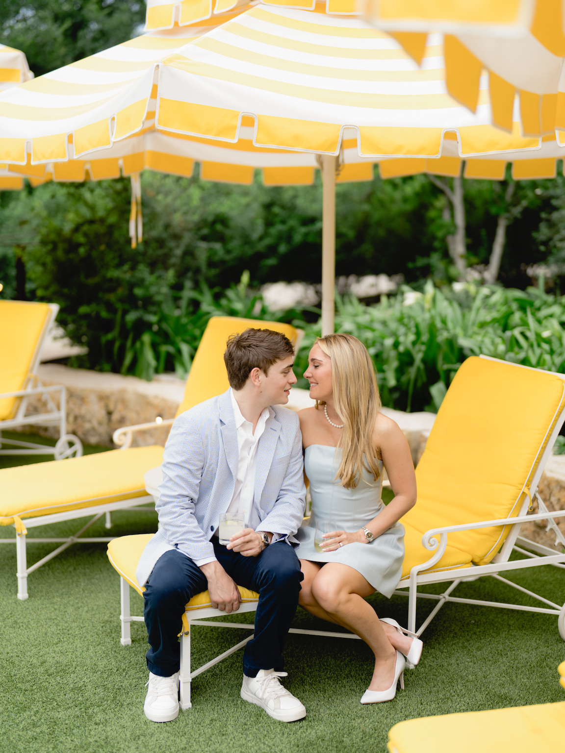Romantic engagement photo of couple standing by the pool at Commodore Perry Estate