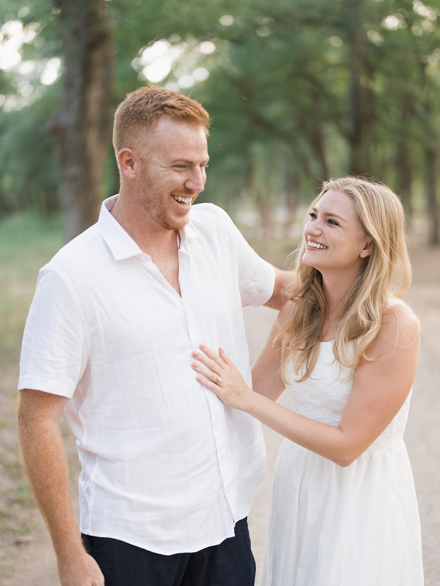 couple walking at McKinney Falls engagement